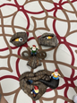 Garden sculpture, outdoor, little elf climbing a tree, three gnomes, artwork.